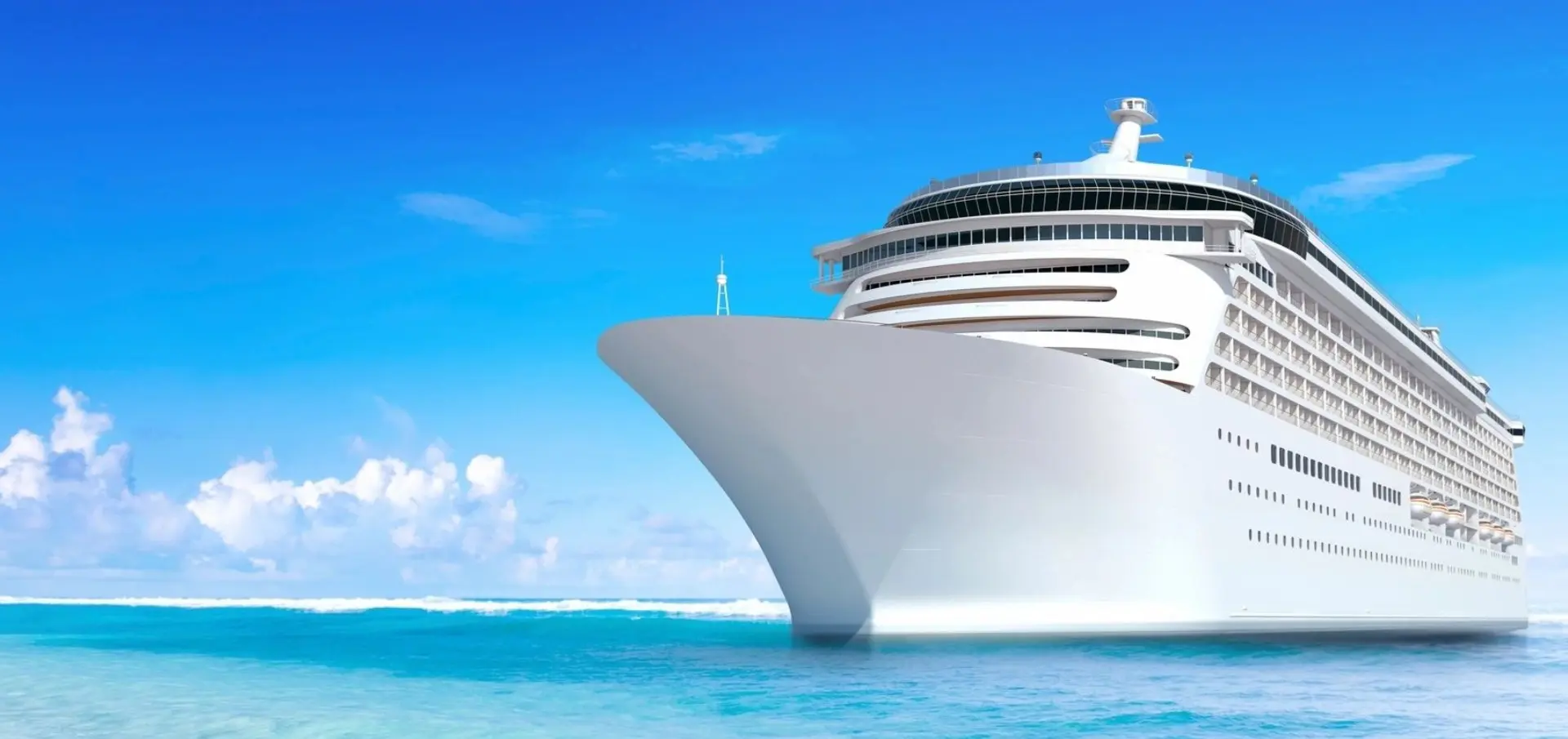 A large cruise ship in the ocean with blue skies.
