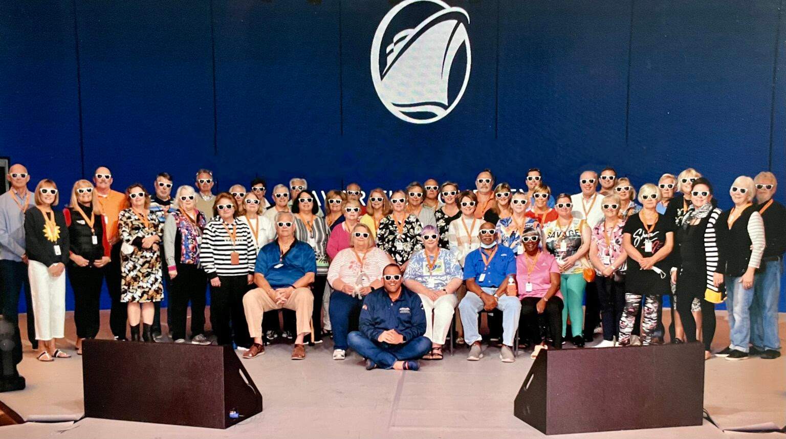 A group of people that are sitting in front of a microphone.